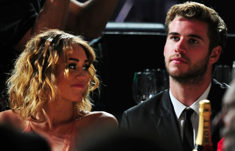 Actress Miley Cyrus (L) and actor Liam H